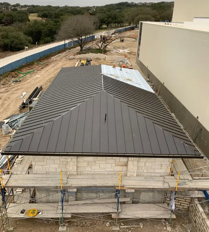 Metal roof new construction with scaffolding in Friendly
